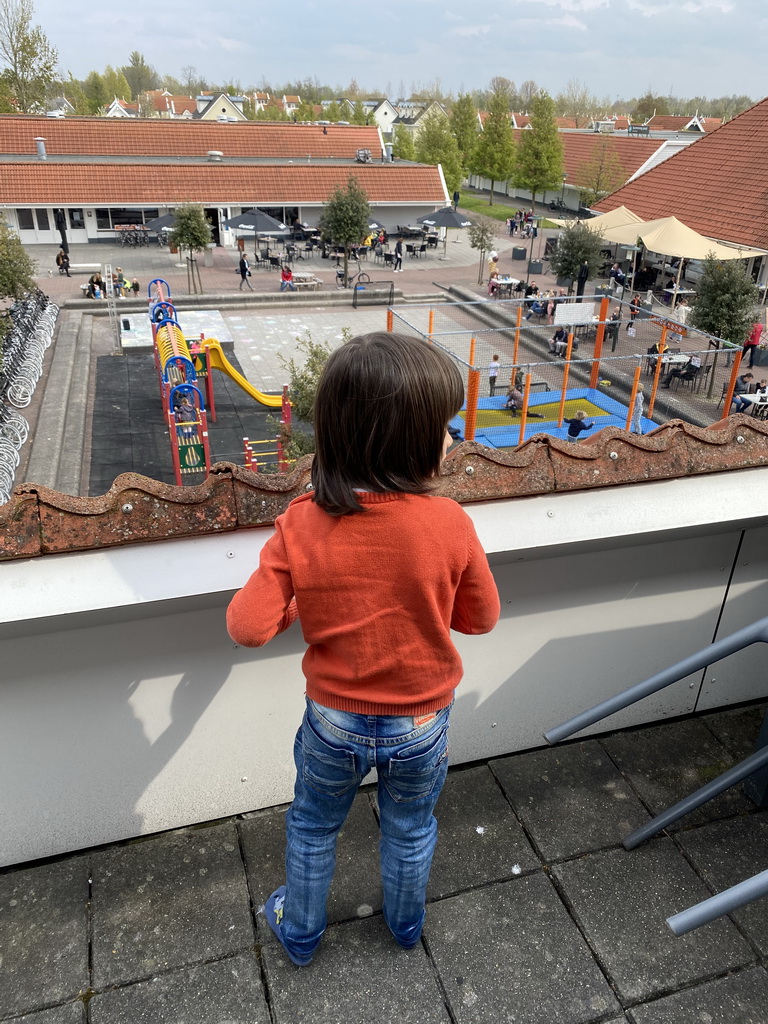 Max on the balcony of the upper floor of our apartment at Holiday Park AquaDelta, with a view on the central square