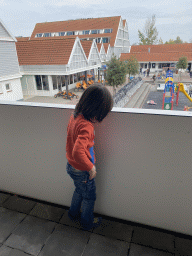 Max on the balcony of the lower floor of our apartment at Holiday Park AquaDelta, with a view on the central square