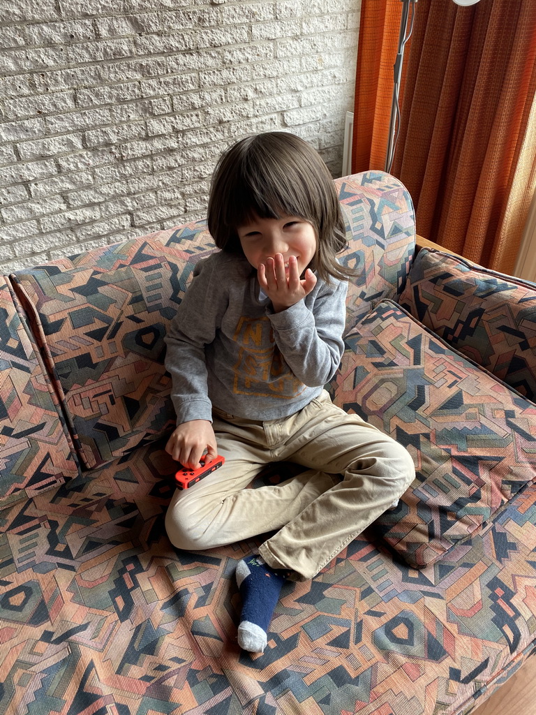 Max playing with the Nintendo Switch in the living room at the upper floor of our apartment at Holiday Park AquaDelta