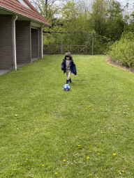 Max playing football on a grassfield at Holiday Park AquaDelta