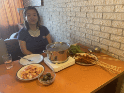 Miaomiao having dinner in the living room at the upper floor of our apartment at Holiday Park AquaDelta