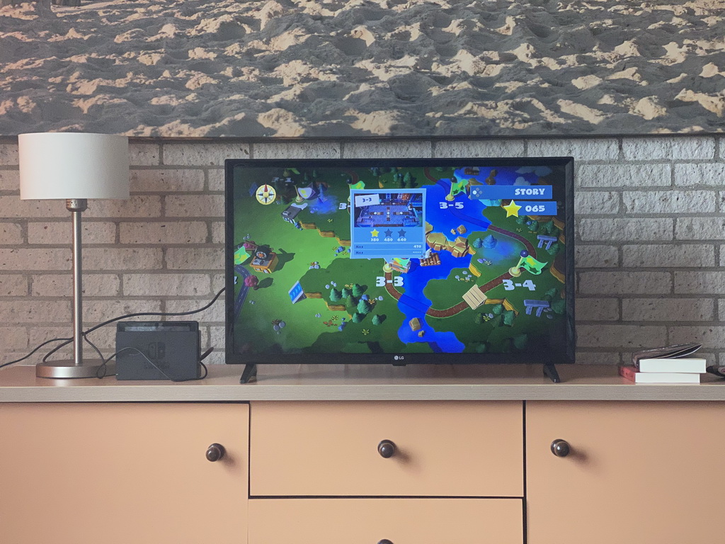 TV screen with the Nintendo Switch game `Overcooked! 2` in the living room at the upper floor of our apartment at Holiday Park AquaDelta