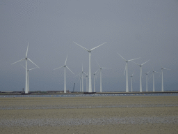 The beach at the south side of the Grevelingendam and windmills at the Krammersluizen sluices