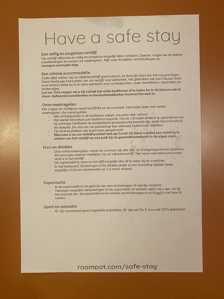 Paper with COVID-19 rules in the living room at the upper floor of our apartment at Holiday Park AquaDelta