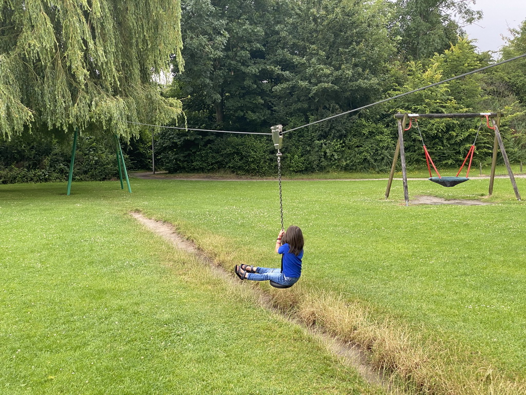 Max on a zip line at the playground of the Kreek op Aquadelta holiday park