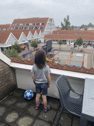 Max on the balcony of the upper floor of our apartment at Holiday Park AquaDelta, with a view on the central square