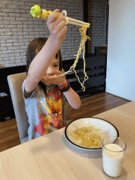 Max eating noodles at the living room at the upper floor of our apartment at Holiday Park AquaDelta