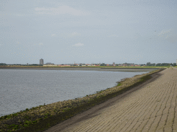 The city center of Zierikzee with windmills, the Sint-Lievensmonstertoren tower, the Nieuwe Kerk church, the Zuidhavenpoort gate and the Nobelpoort gates, viewed from the beach at the Duikplaats Noordbout