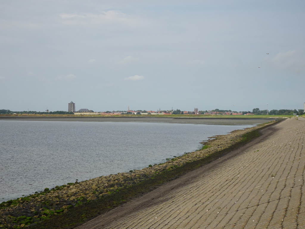 The city center of Zierikzee with windmills, the Sint-Lievensmonstertoren tower, the Nieuwe Kerk church, the Zuidhavenpoort gate and the Nobelpoort gates, viewed from the beach at the Duikplaats Noordbout