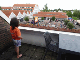 Max on the balcony of the upper floor of our apartment at Holiday Park AquaDelta, with a view on the central square