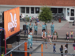 People dancing at the central square of Holiday Park AquaDelta, viewed from the balcony of the upper floor of our apartment