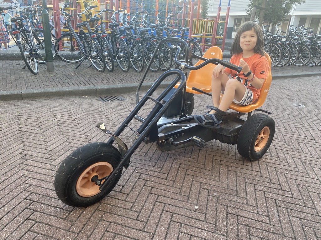 Max on a tricycle at the central square of Holiday Park AquaDelta