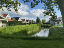 Holiday homes and a creek at Holiday Park AquaDelta