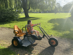 Max on a tricycle at the playground of the Kreek op Aquadelta holiday park