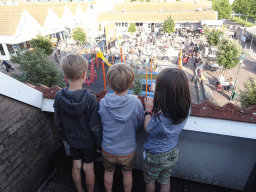 Max and his friends on the balcony of the upper floor of our apartment at Holiday Park AquaDelta, with a view on the mascot Koos Konijn at the central square