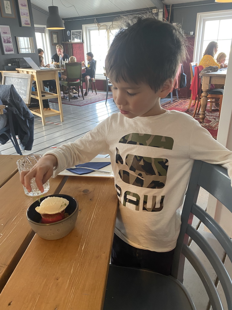 Max eating ice cream at the Bru 17 restaurant