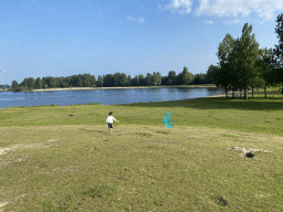 Max flying a kite on a beach at the north side of the Grevelingendam