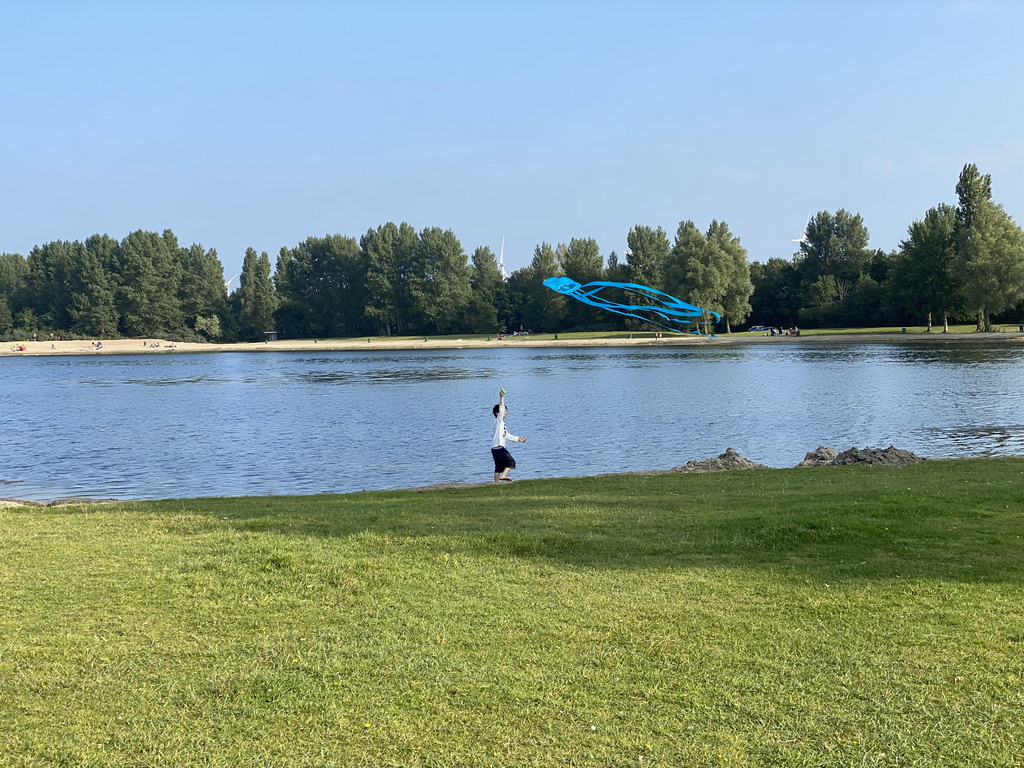 Max flying a kite on a beach at the north side of the Grevelingendam