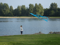 Max flying a kite on a beach at the north side of the Grevelingendam