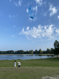 Max and his friend flying a kite on a hill at the north side of the Grevelingendam