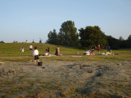 Max and our friends picnicking and flying kites on a beach at the north side of the Grevelingendam