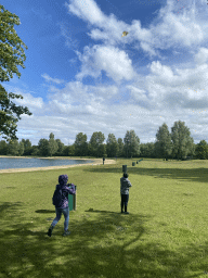 Our friends flying a kite on a beach at the north side of the Grevelingendam