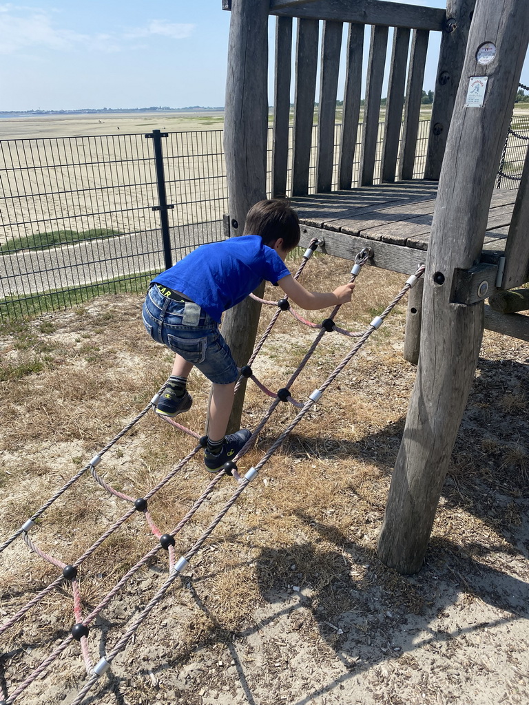 Max on a rope bridge at the playground of Restaurant Grevelingen at the south side of the Grevelingendam