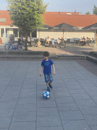 Max playing football at the central square of Holiday Park AquaDelta