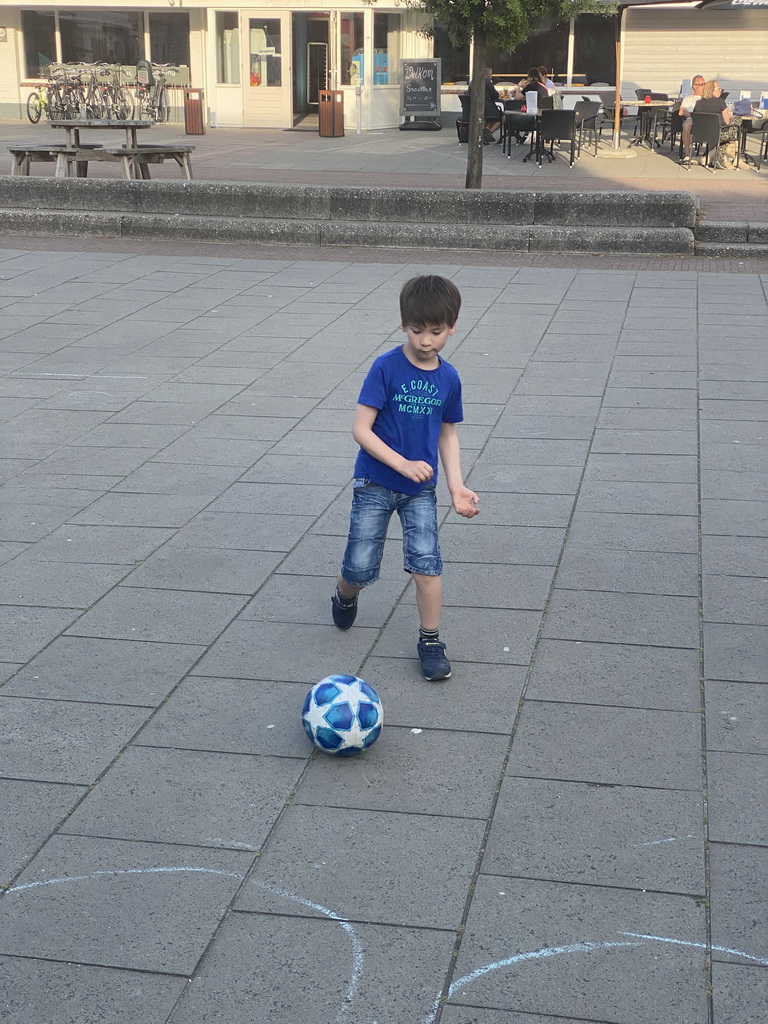 Max playing football at the central square of Holiday Park AquaDelta