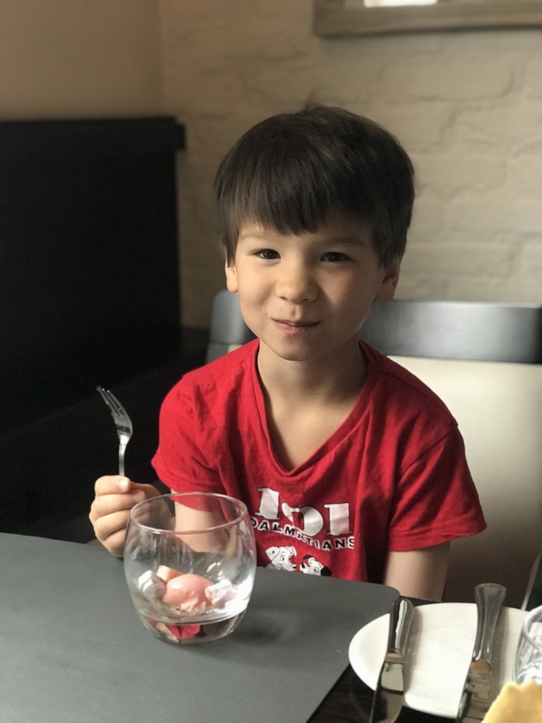 Max with ice cream and fruit at the Brasserie De Cleenne Mossel restaurant