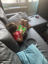 Max playing with iPad in the living room at the lower floor of our apartment at Holiday Park AquaDelta