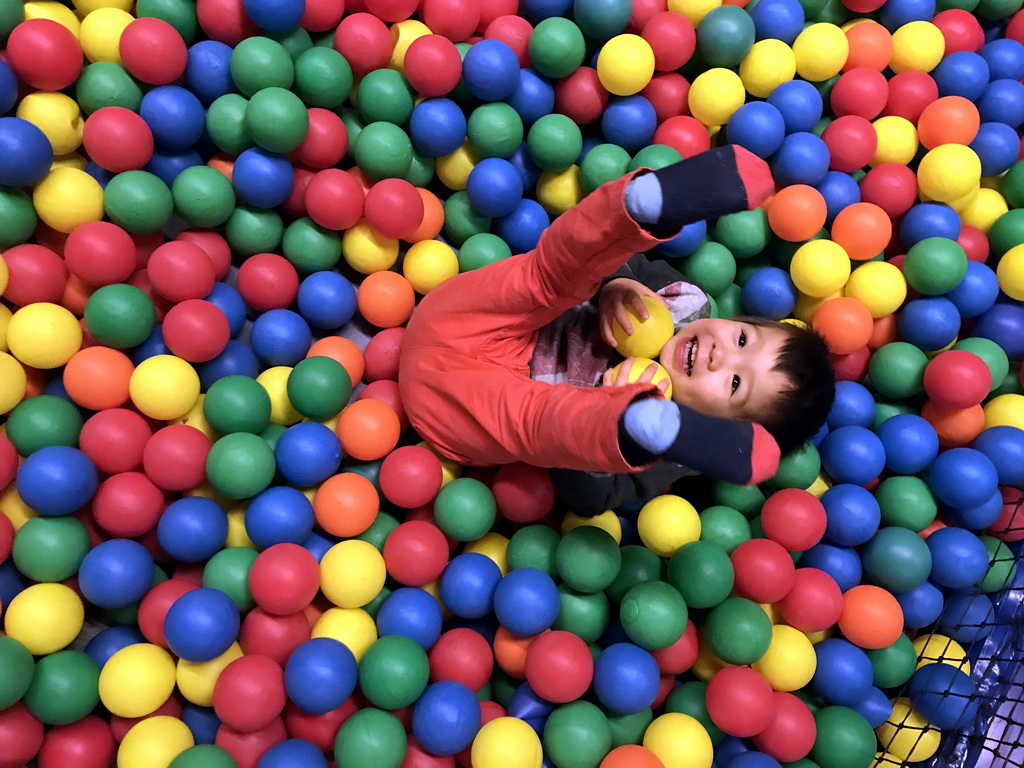 Max playing in the ball pit at the Kinderland playground at Holiday Park AquaDelta