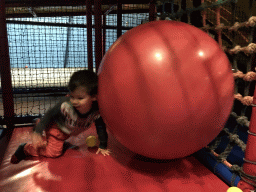 Max playing with a large ball at the Kinderland playground at Holiday Park AquaDelta