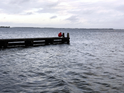 Miaomiao catching crabs on a pier at the northwest side of the Grevelingendam