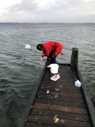 Miaomiao catching crabs on a pier at the northwest side of the Grevelingendam