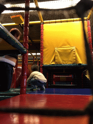 Miaomiao and Max playing at the climbing rack at the Kinderland playground at Holiday Park AquaDelta