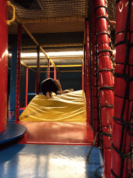 Miaomiao and Max playing at the climbing rack at the Kinderland playground at Holiday Park AquaDelta