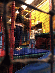 Miaomiao and Max playing at the climbing rack at the Kinderland playground at Holiday Park AquaDelta