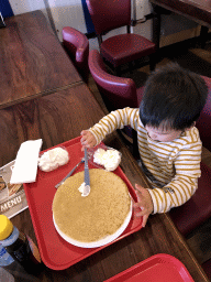 Max eating a pancake at the De Branding restaurant at Holiday Park AquaDelta