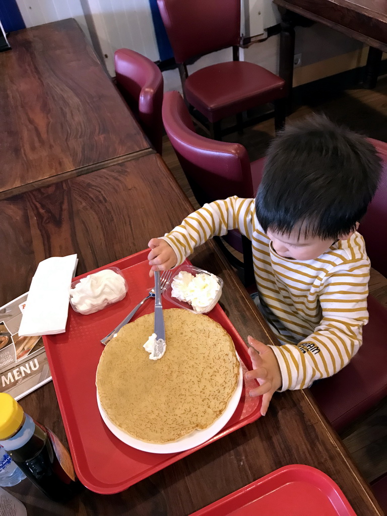 Max eating a pancake at the De Branding restaurant at Holiday Park AquaDelta