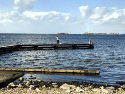 Miaomiao catching crabs on a pier at the northwest side of the Grevelingendam