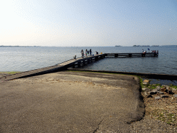 People catching crabs on a pier at the northwest side of the Grevelingendam
