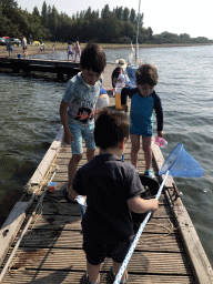 Max and other people catching crabs on a pier at the northwest side of the Grevelingendam