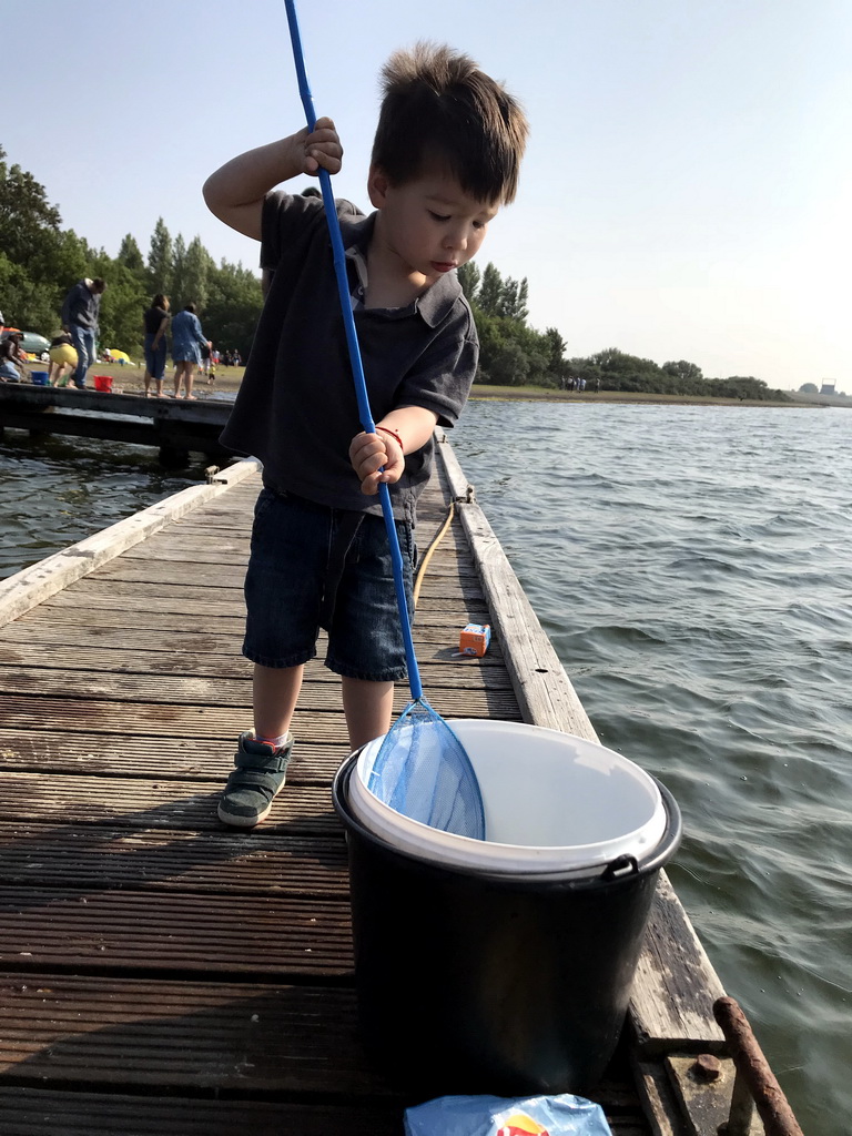 Max catching crabs on a pier at the northwest side of the Grevelingendam