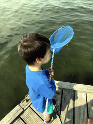 Max catching crabs on a pier at the northwest side of the Grevelingendam