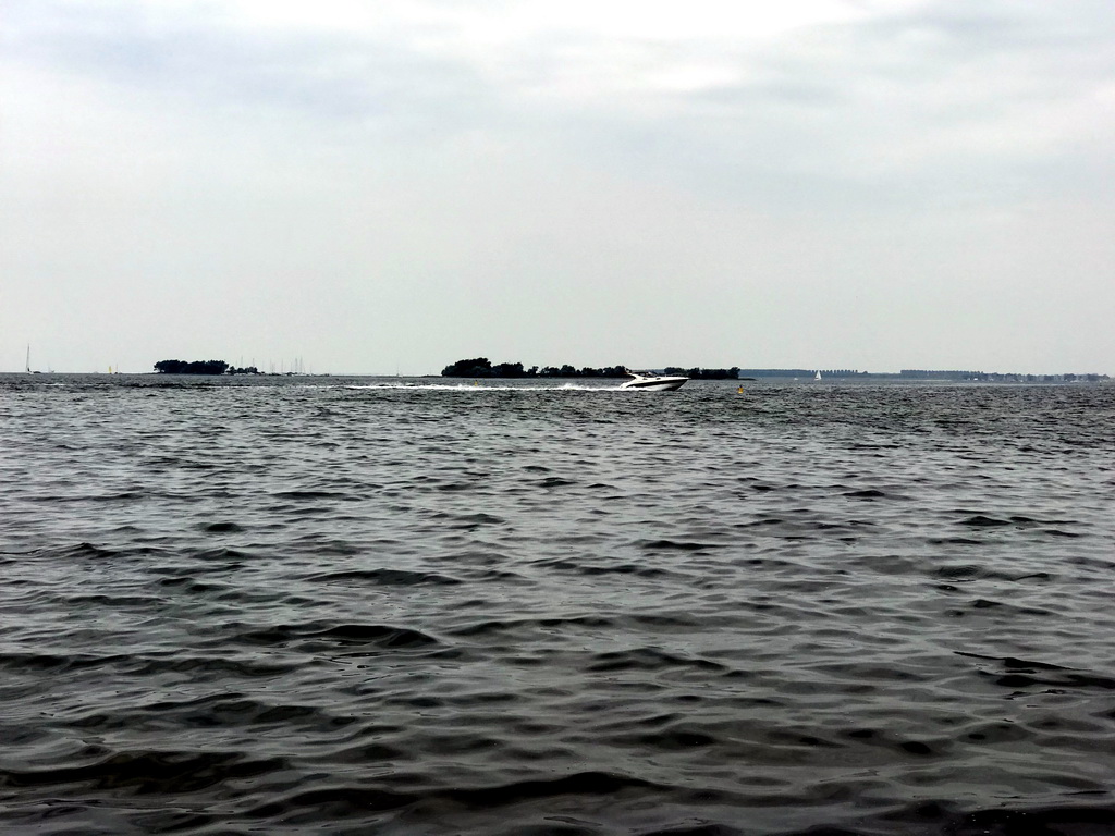 Boat on the Grevelingenmeer lake, viewed from the northwest side of the Grevelingendam