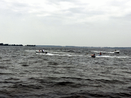 Boats and water skiers on the Grevelingenmeer lake, viewed from the northwest side of the Grevelingendam