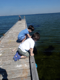 Max and a friend catching crabs on a pier at the northwest side of the Grevelingendam
