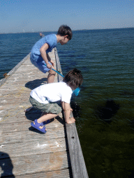 Max and a friend catching crabs on a pier at the northwest side of the Grevelingendam