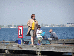 Miaomiao and Max catching crabs on a pier at the northwest side of the Grevelingendam